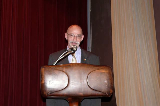 John Humphrey speaking at a conference podium